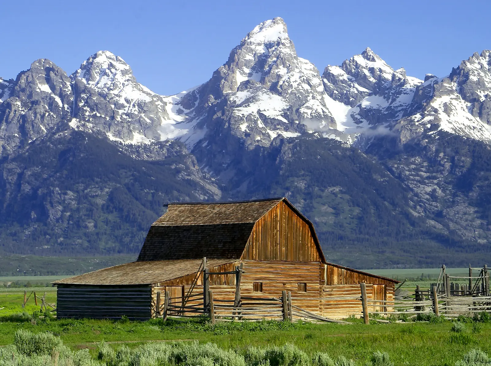 Jackson Hole summer group trip for solo travelers, Mormon Row barn below the Tetons